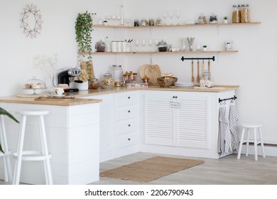 Cozy White Empty Kitchen, Modern Interior Without Stove And Sink Made In Rural Style, Comfortable Warm Light Kitchen Full Of Utensils, Furniture, Coffee Machine. Home Interiors Concept