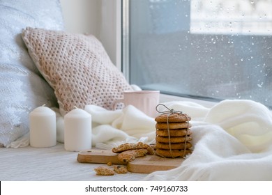 cozy winter still life: warm woolen knitting, hot tea, red book,  cookies and music. Headphones. Hygge style. Cozy winter home morning holiday. Soft photo - Powered by Shutterstock