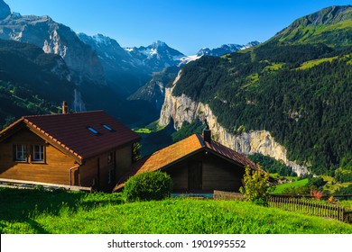 Cozy wooden lodges with amazing views from the Wengen mountain resort. Lauterbrunnen valley and mountains with glaciers in background, Bernese Oberland, Switzerland, Europe