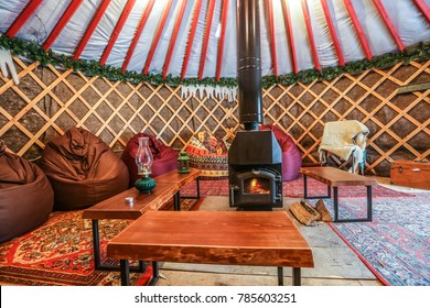 Cozy Yurt Camping Interior With Fireplace Inside. Authentic Glamping Territory.