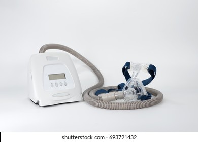  
Cpap Continuous positive airway pressure system includes of cpap machine,mask,tube and headgear,front view.Full components of Cpap machine ,isolated white background.