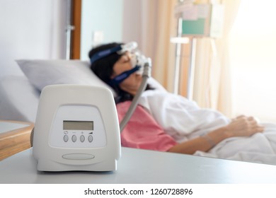 Cpap Machine Is Treating Senior Patient Woman Wearing Cpap Mask Sleeping Smoothly Without Snoring In Hospital Room.
Obstructive Sleep Apnea Therapy.