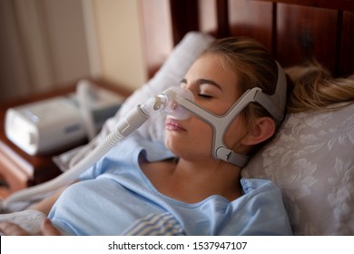 Cpap machine, Woman using sleeping sleep apnea 