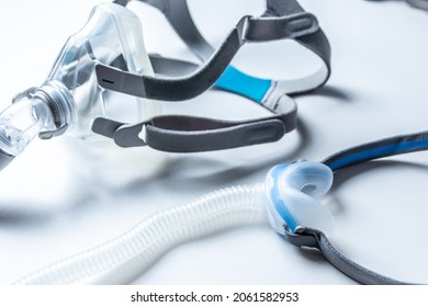 CPAP mask against obstructive sleep apnea helps patients respirator mask headgear clip for nose and throat breathing medication with cpap machine against snoring and sleep disorder to breath easier - Shutterstock ID 2061582953