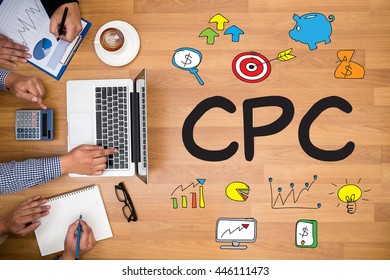 CPC      cost per click Business team hands at work with financial reports and a laptop