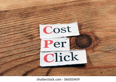 CPC - cost per click, on  paper on wooden background