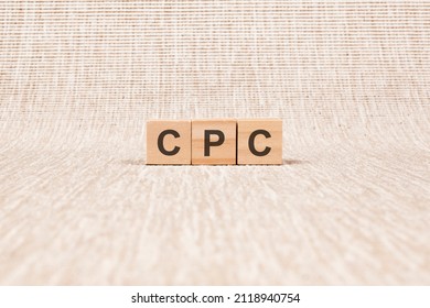 CPC word written on wood blocks. text on broun backgrond for your desing, concept