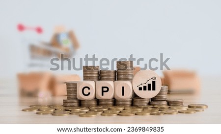 CPI, consumer price index concept. Wooden block with the words CPI on coins stack. Goods price inflation and inflation rising. Impact on economic growth with relate icon. 
