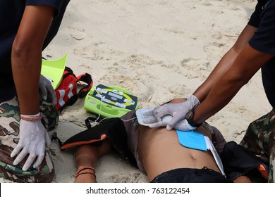 CPR and AED on the beach ,Training Automated External Defibrillator for Rescue and first aid in Thailand. - Powered by Shutterstock