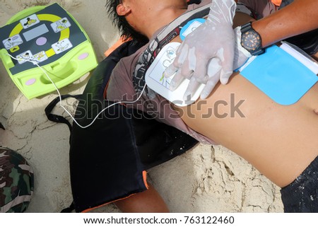 CPR and AED on the beach ,Training Automated External Defibrillator for Rescue and first aid in Thailand.