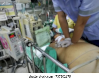 CPR, cardio pulmonary resuscitation cardiac arrest patient in emergency room, defocus