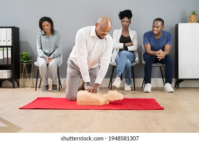 CPR First Aid Lifeguard Or Paramedic Class With African Students - Powered by Shutterstock