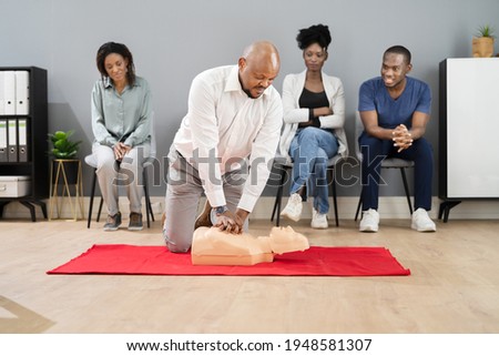 CPR First Aid Lifeguard Or Paramedic Class With African Students