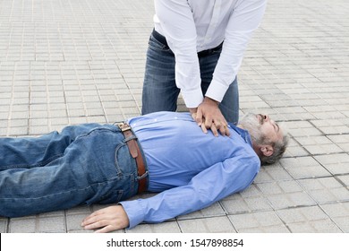 CPR. initiation phase of thoracic compressions, seen closely