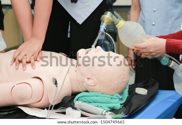 CPR Training\
Chest Compression on Manikin, CPR Training in emergency refresher\
training to assist of\
physician.