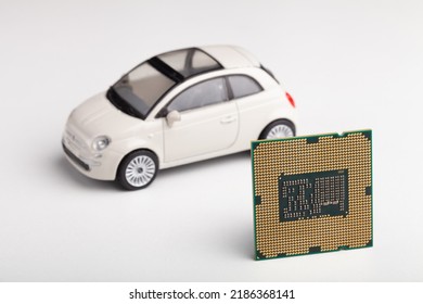 CPU Chip And Semiconductors With Car. Micro-chip For Cars. Computer Chip Shortage Stalls Car Industry Production