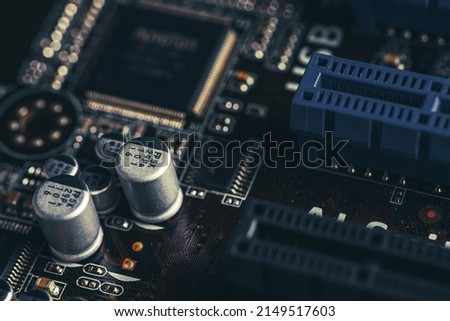 CPU power supply circuit on the motherboard, mosfets, solid-state capacitors, chokes, field-effect transistors, close-up, the choice of a gaming computer motherboard, VRM.