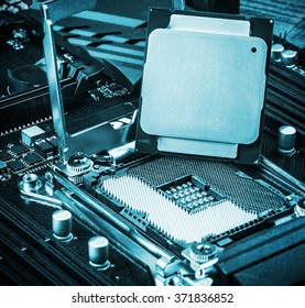 CPU socket and processor on the motherboard. Focus on the CPU. toned image