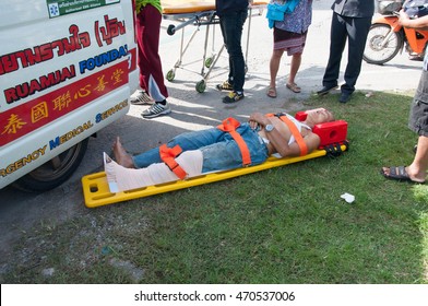 CR, THAILAND. August 18, 2016: Accident Car Crash With An Elderly Man Wounded And Received First Aid Correctly By The Rescue Team. 