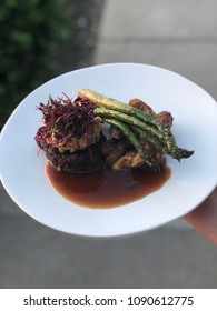 Crab Cake Topped Filet Mignon With Roasted Fingerling Potatoes And Grilled Asparagus