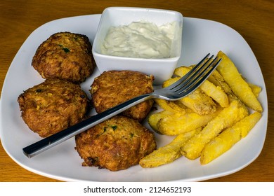 Crab Cakes With Tarter Sauce  And A Side Of Fries