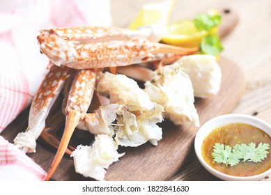 Crab Meat / Cooked Crab Claws And Legs On Wooden And Seafood Sauce On The Table , Blue Swimming Crab 