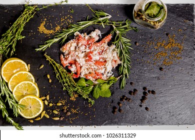 Crab Meat Lying On A Black Dish