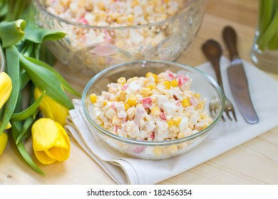 Crab Meat, Rice And Corn Salad With Mayonnaise Sauce And Yellow Tulips