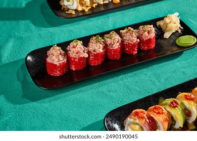 Crab Rolls with Tobiko on Black Plate – Vibrant Sushi Presentation. - Powered by Shutterstock