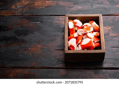 Crab Sticks Seafood Semi Finished Fish Mince With Blue Swimming Crab Set, In Wooden Box, On Dark Wooden Background , With Copyspace  And Space For Text