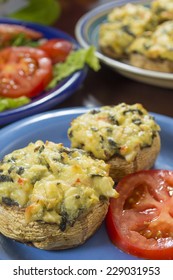 Crab Stuffed Mushrooms Ready To Eat Served With Garden Fresh Sliced Tomatoes 