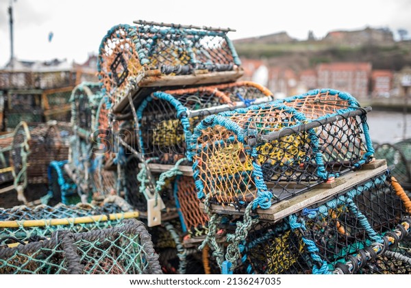 Crab traps stacked in a\
single pile.