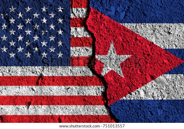 Crack between America and Cuba flags. political\
relationship concept