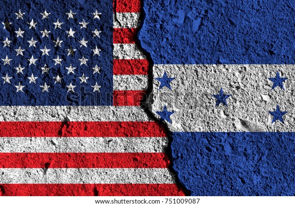 Crack between America and Honduras flags.\
political relationship\
concept