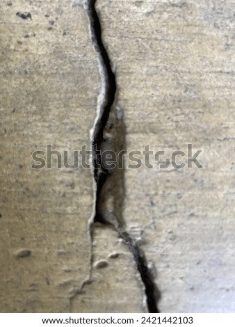 A crack in a cement table

The intemperism of the nature generated this crack naturally. You can ample the image and enjoy