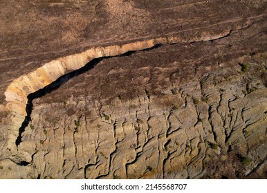 Crack In Dry Ground. Dry Lake In Process Of Drought And Lack Of Rain. Cracked Soil Of Due To Climate Change. Soil Earth Background, Top View. Relief Of Cracked Earth. Land Structure Or Ground Texture.