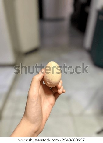Crack the egg and peel it