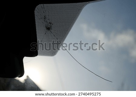 crack and impact on windshield from inside
