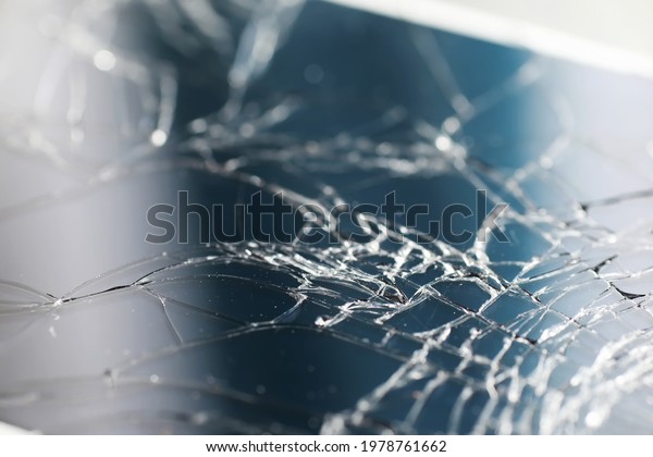 Crack on the glass.
Broken screen. Broken phone. Cracked glass background. White cracks
in glass.