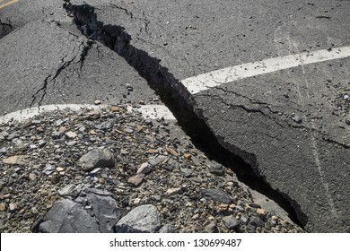 A crack in the pavement, the destruction of the road