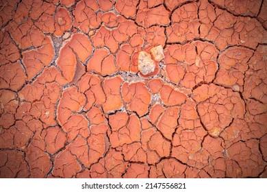 Crack Soil Ground Texture. The Natural Texture Of Soil With Cracks. Broken Clay Surface Of Barren Dryland Wasteland Closeup. Full Frame Terrain With Arid Climate. The Surface Of The Land Is Cracked.