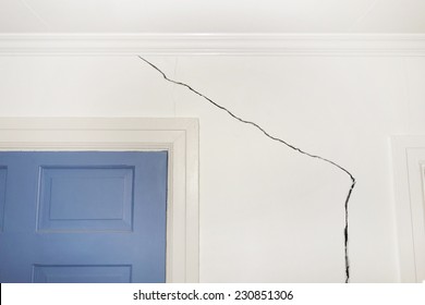 Crack in the wall of a home indicating foundation defects                               