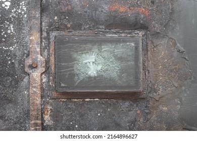 Cracked Armored Glass In The Window Of A Destroyed Military Vehicle.