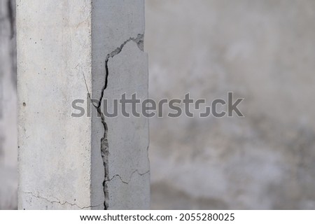 Cracked cement columns, unsafe and dangerous structures.
