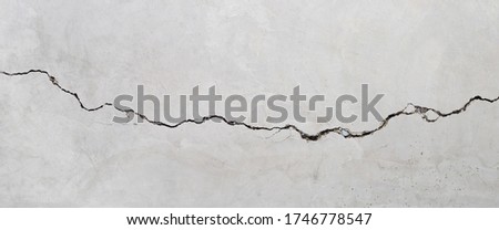 Cracked cement wall texture for background.