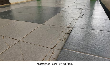 cracked ceramics in building corridors caused by weather and heavy loads