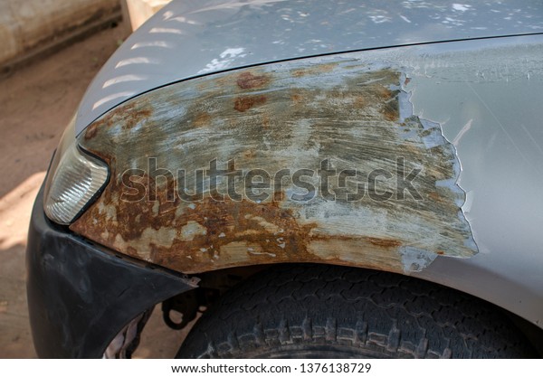 Cracked\
color car surface texture of the front car part close to the head\
light and turn signal light, rustic car\
part