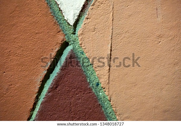 cracked color on a wall\
outside