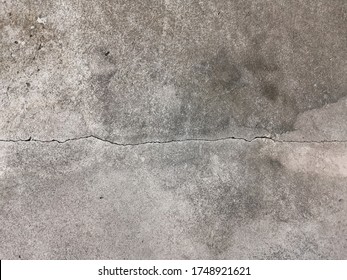 Cracked Concrete In The Basement Floor Texture.