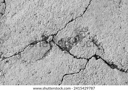Cracked concrete floor texture background. Grunge and rough surface. 